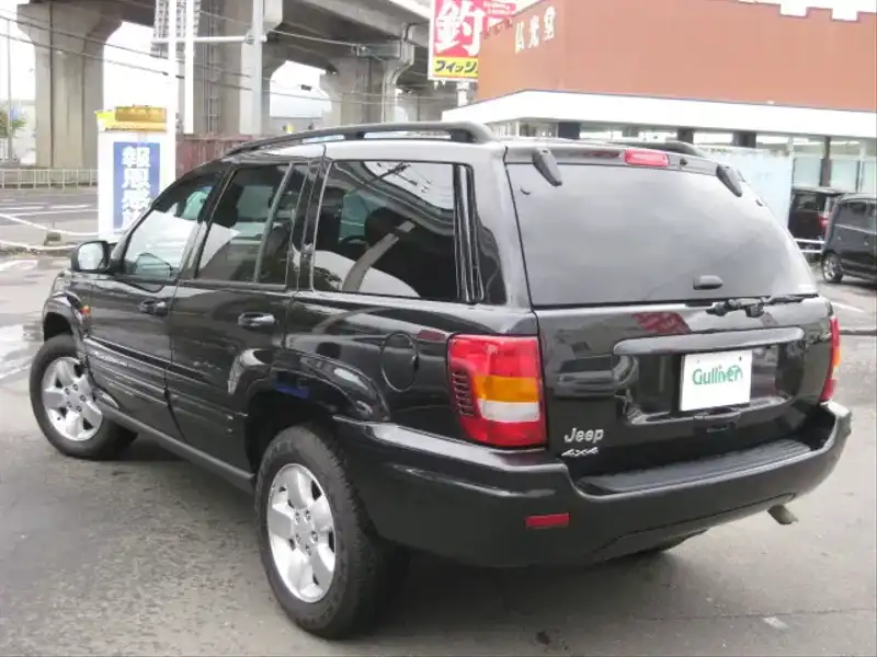 カタログ画像：ジープ・グランドチェロキー（JEEP GRAND CHEROKEE） リミテッド 2004年4月 GH-WJ40 4000cc ブリリアントブラッククリスタルパールコート 燃費6.5km / l  バック