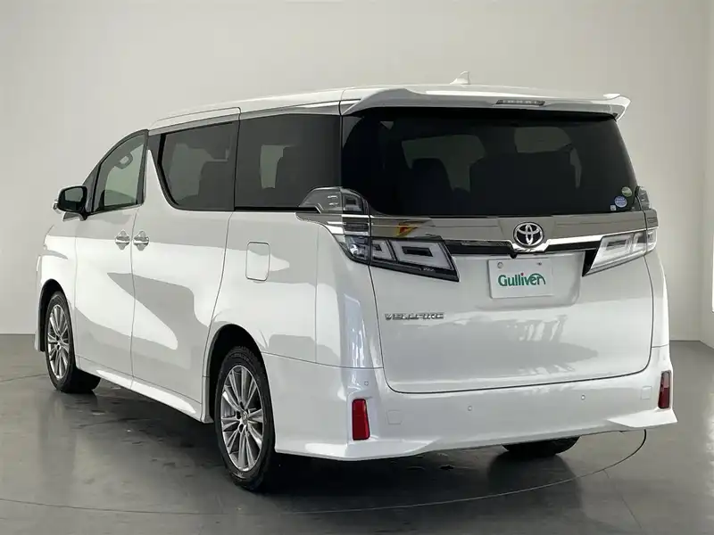 カタログ画像：ヴェルファイア（VELLFIRE） ２．５Ｚ サイドリフトアップチルトシート装着車 2018年10月 DBA-AGH30W 2500cc ホワイトパールクリスタルシャイン 燃費11.6km / l バック