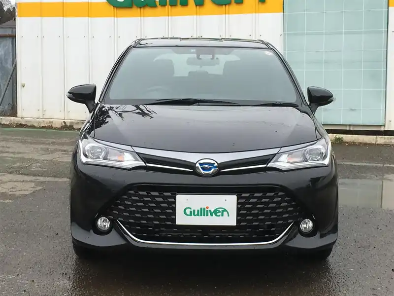 カタログ画像：カローラフィールダー（COROLLA FIELDER） ハイブリッドＧ ダブルバイビー 2015年4月 DAA-NKE165G 1500cc ブラックマイカ 燃費33.8km / l フロント