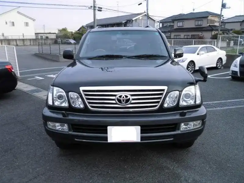 カタログ画像：ランドクルーザー１００（LAND CRUISER 100） シグナス 2005年4月 GH-UZJ100W 4700cc ブラック 燃費6.5km / l  フロント