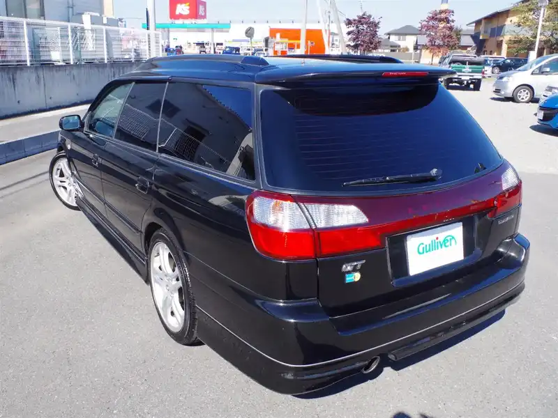 カタログ画像：レガシィツーリングワゴン（LEGACY TOURING WAGON） ＧＴ－ＢリミテッドⅡ 2002年10月 TA-BH5 2000cc ブラックトパーズ・マイカ 燃費10.6km / l  バック