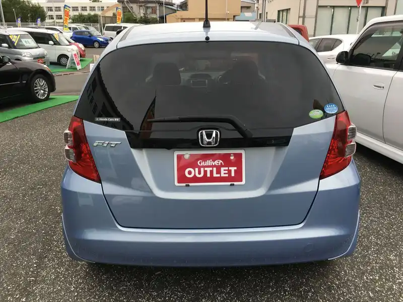 カタログ画像：フィット（FIT） Ｌ スマートスタイルエディション 2009年5月 DBA-GE6 1300cc シャーベットブルー・メタリック 燃費21.5km / l  バック