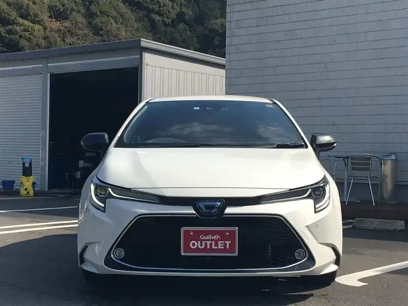 カタログ画像：カローラツーリング（COROLLA TOURING） ハイブリッド ダブルバイビー 2019年10月 6AA-ZWE214W 1800cc ホワイトパールクリスタルシャイン 燃費24.4km / l フロント