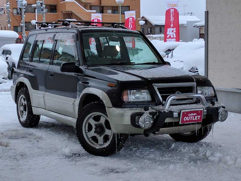 カタログ画像：エスクード（ESCUDO） Ｇ－リミテッド ５ドア２０００ 1997年1月 E-TD51W 2000cc サターンブラックメタリック 燃費11.8km / l  メイン