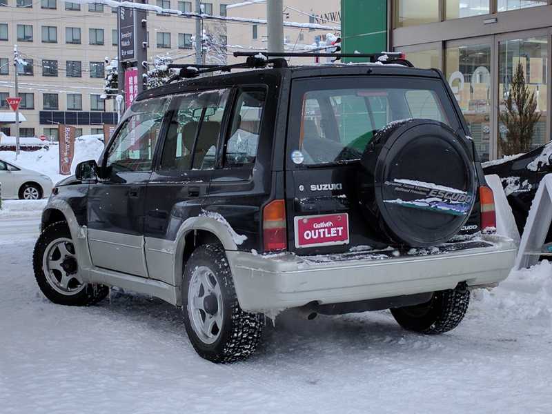 カタログ画像：エスクード（ESCUDO） Ｇ－リミテッド ５ドア２０００ 1997年1月 E-TD51W 2000cc サターンブラックメタリック 燃費11.8km / l  バック