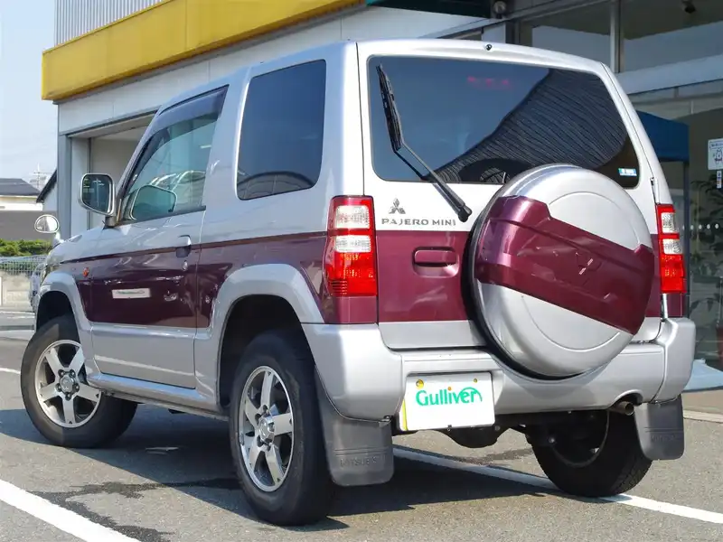 カタログ画像：パジェロミニ（PAJERO MINI） ナビエディションＸＲ 2009年12月 ABA-H53A 660cc ラズベリーレッドパールorクールシルバーメタリック／ラズベリーレッドパール／クールシルバーメタリック・３ウェイ２トーン バック