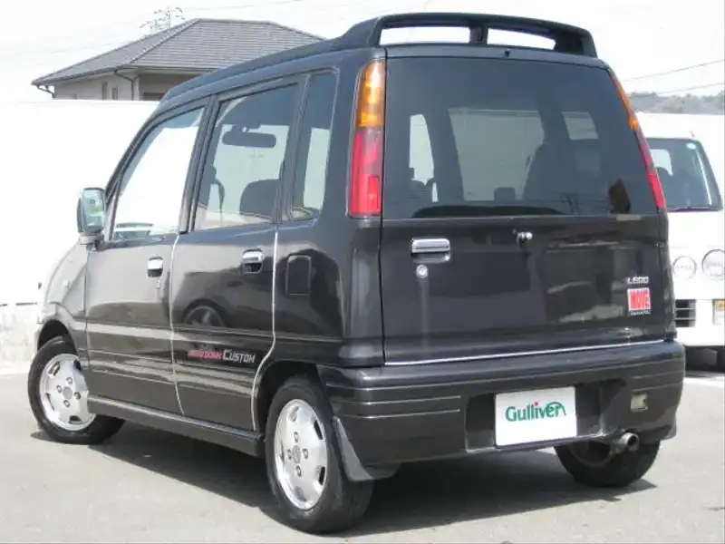 カタログ画像：ムーヴ（MOVE） カスタム 1997年5月 E-L600S 660cc ブラックメタリック 燃費17.6km / l  バック