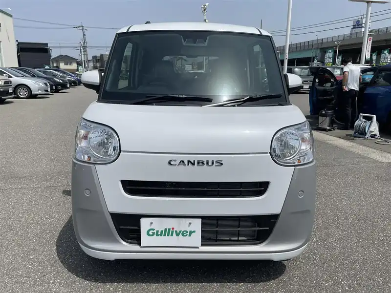 カタログ画像：ムーヴキャンバス（MOVE CANBUS） ストライプスＸ 2022年7月 5BA-LA860S 660cc シャイニングホワイトパール×スムースグレーマイカメタリック 燃費21.6km / l フロント