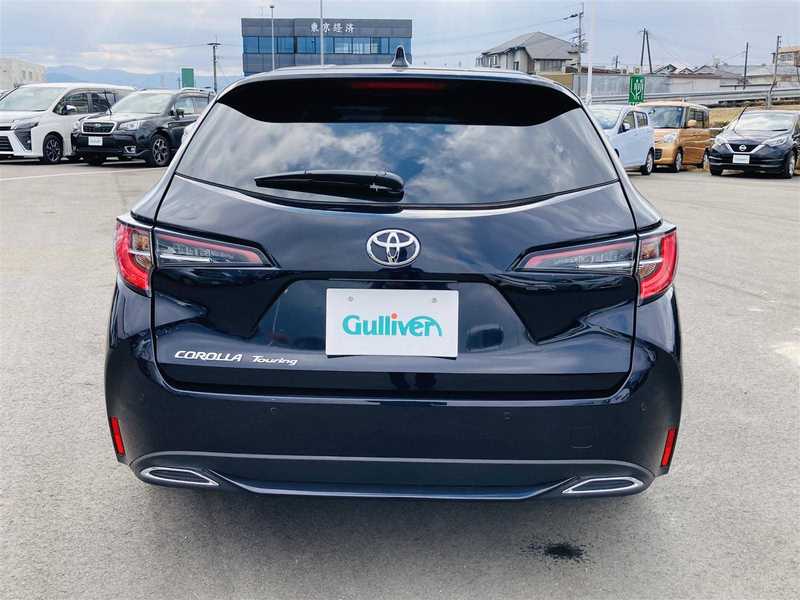カタログ画像：カローラツーリング（COROLLA TOURING） ハイブリッド Ｇ 2024年4月 6AA-ZWE215W 1800cc アティチュードブラックマイカ 燃費27.5km / l バック