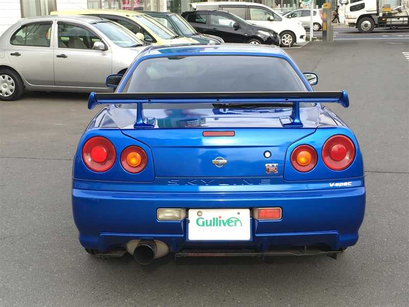 カタログ画像：スカイライン（SKYLINE） ＧＴ－Ｒ Ｖスペック ミッドナイトパープルⅢ 2000年1月 GF-BNR34 2600cc ミッドナイトパープルⅢ 燃費8.1km / l  バック