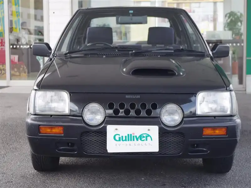 カタログ画像：マーチ（MARCH） スーパーターボ 1990年1月 E-EK10 1000cc ブラックＭ 燃費16.0km / l  フロント