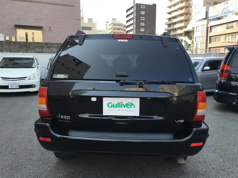 カタログ画像：ジープ・グランドチェロキー（JEEP GRAND CHEROKEE） リミテッドＶ８ 2004年4月 GH-WJ47 4700cc ブリリアントブラッククリスタルパールコート 燃費5.9km / l  バック