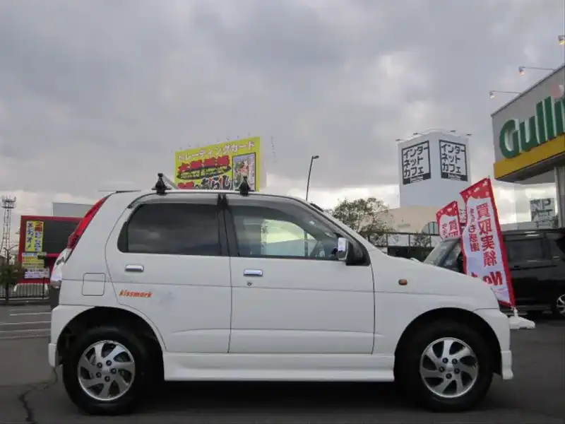 カタログ画像：テリオスキッド（TERIOS KID） キスマークＸ 2005年10月 TA-J111G 660cc ホワイト 燃費16.8km / l  外装