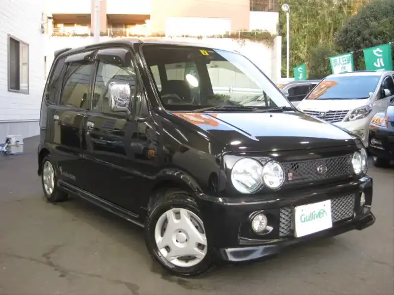 カタログ画像：ムーヴ（MOVE） ハローキティ 2001年10月 LA-L910S 660cc ブラックマイカ 燃費16.4km / l  メイン