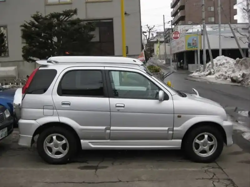 カタログ画像：キャミ（CAMI） Ｑ ターボエアロバージョン 2002年1月 TA-J102E 1300cc シルバーメタリック 燃費12.8km / l  外装