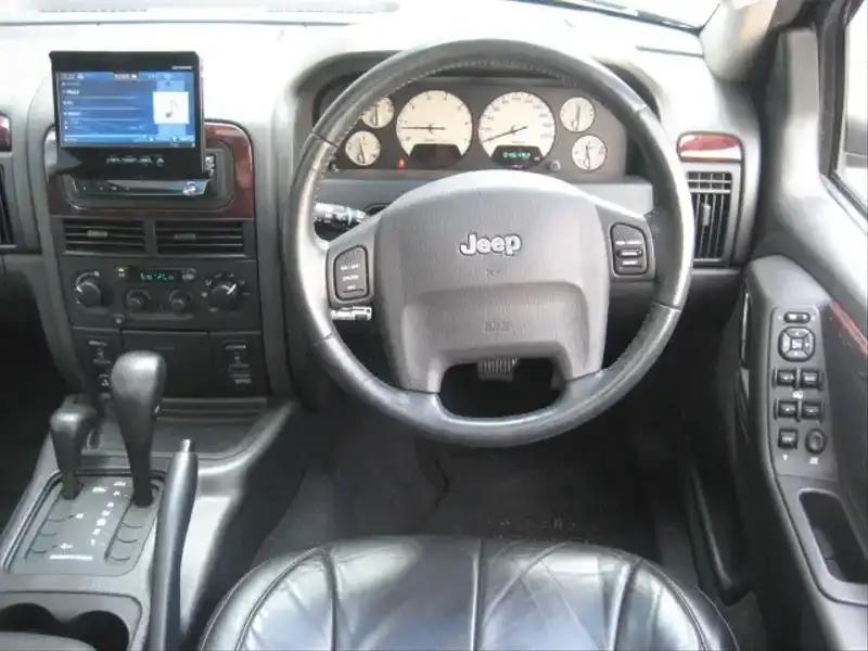 カタログ画像：ジープ・グランドチェロキー（JEEP GRAND CHEROKEE） リミテッドＶ８ 2004年4月 GH-WJ47 4700cc パトリオットブルーパールコート 燃費5.9km / l  内装