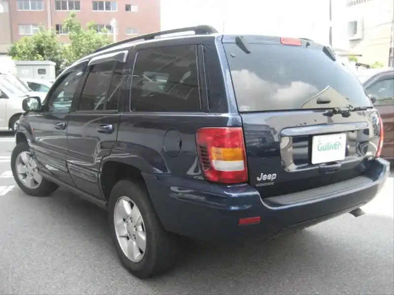 カタログ画像：ジープ・グランドチェロキー（JEEP GRAND CHEROKEE） リミテッドＶ８ 2004年4月 GH-WJ47 4700cc パトリオットブルーパールコート 燃費5.9km / l  バック