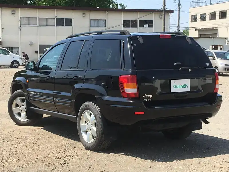 カタログ画像：ジープ・グランドチェロキー（JEEP GRAND CHEROKEE） リミテッド 2004年4月 GH-WJ40 4000cc パトリオットブルーパールコート 燃費6.5km / l  バック