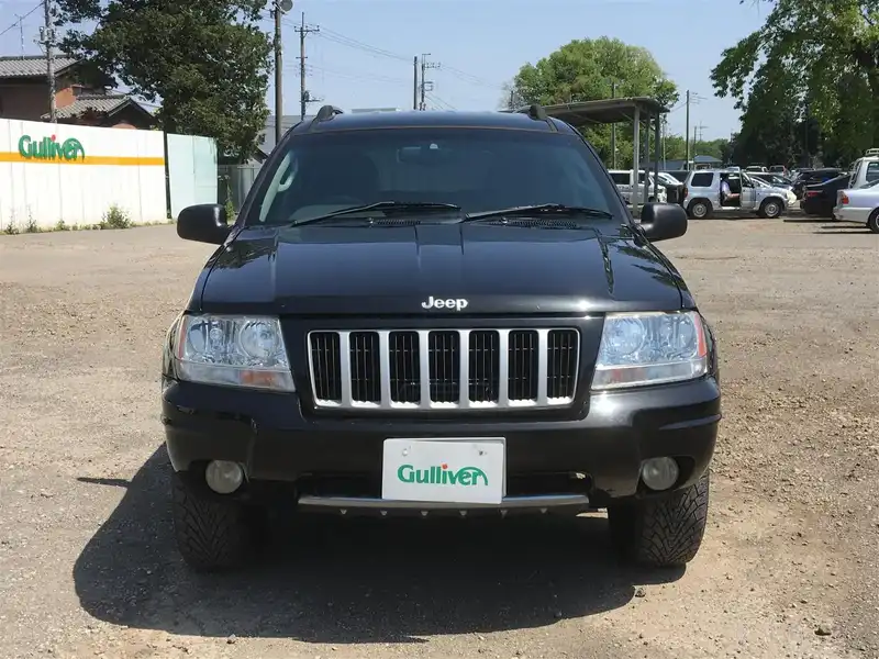 カタログ画像：ジープ・グランドチェロキー（JEEP GRAND CHEROKEE） リミテッド 2004年4月 GH-WJ40 4000cc パトリオットブルーパールコート 燃費6.5km / l  フロント