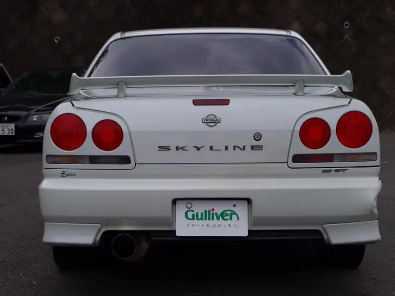 カタログ画像：スカイライン（SKYLINE） ２５ＧＴ－Ｖ 1999年2月 GF-ER34 2500cc ホワイト 燃費10.6km / l  バック