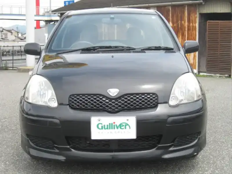 カタログ画像：ヴィッツ（VITZ） Ｆ Ｌパッケージ 2004年2月 CBA-SCP10 1000cc ブラックマイカ 燃費21.5km / l  フロント