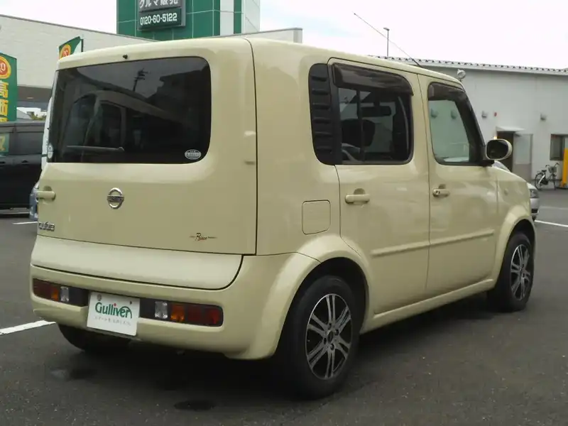 カタログ画像：キューブ（CUBE） ＳＸ ７０ｔｈ 2003年5月 UA-BNZ11 1400cc ビーンズorパプリカオレンジ（Ｍ） 燃費15.8km / l  バック