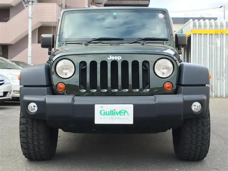 カタログ画像：ジープ・ラングラーアンリミテッド（JEEP WRANGLER UNLIMITED） スポーツ４ＡＴ 2008年11月 ABA-JK38L 3800cc ジープグリーンメタリッククリアコート 燃費7.1km / l  フロント