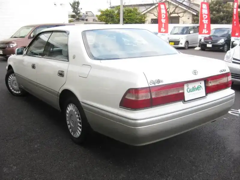 カタログ画像：クラウン（CROWN） ロイヤルエクストラリミテッド 1997年4月 E-JZS151 2500cc スーパーホワイトパールマイカ 燃費9.0km / l  バック