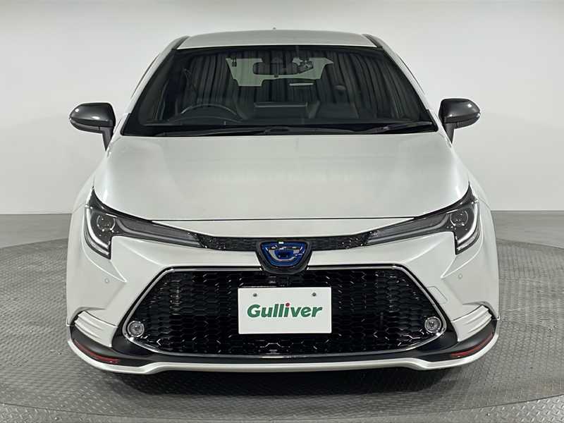 カタログ画像：カローラツーリング（COROLLA TOURING） ハイブリッド Ｇ 2024年4月 6AA-ZWE219W 1800cc プラチナホワイトパールマイカorアティチュードブラックマイカ×プラチナホワイトパールマイカ 燃費29.3km / l フロント