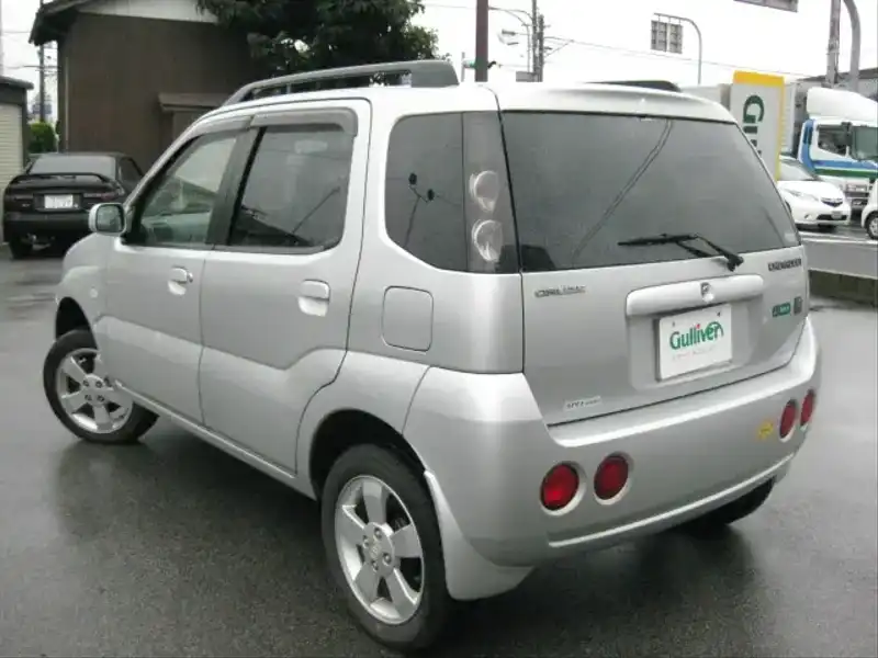 カタログ画像：シボレークルーズ（CHEVROLET CRUSE） １．３ＬＳ ２ＷＤ ナビエディション 2003年1月 LA-HR51S 1300cc シルキーシルバーメタリック 燃費17.4km / l  バック