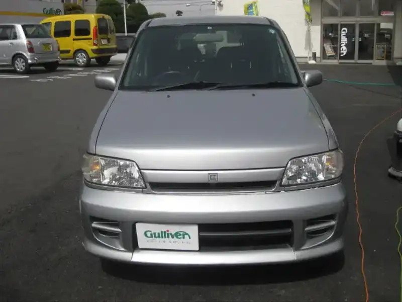 カタログ画像：キューブ（CUBE） コールマンバージョン 2001年5月 TA-AZ10 1300cc ソニックシルバー（Ｍ）ｏｒシャーベットシルバー（ＴＭ） 燃費14.8km / l  フロント