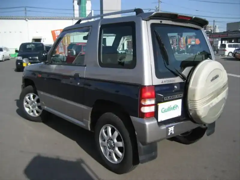 カタログ画像：パジェロミニ（PAJERO MINI） アニバーサリーリミテッド－Ｖ 1998年1月 E-H56A 660cc シンフォニックシルバー／ネアーズブルー／シンフォニックシルバー・３ウェイ２トーン バック