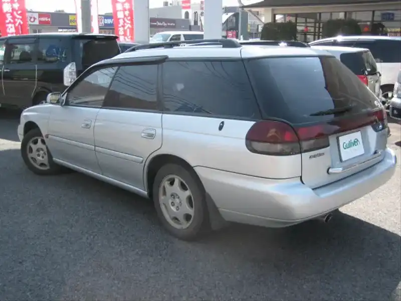 カタログ画像：レガシィツーリングワゴン（LEGACY TOURING WAGON） ブライトンゴールドエアサス 1997年2月 E-BGA 2000cc ライトシルバー・メタリック 燃費11.2km / l  バック