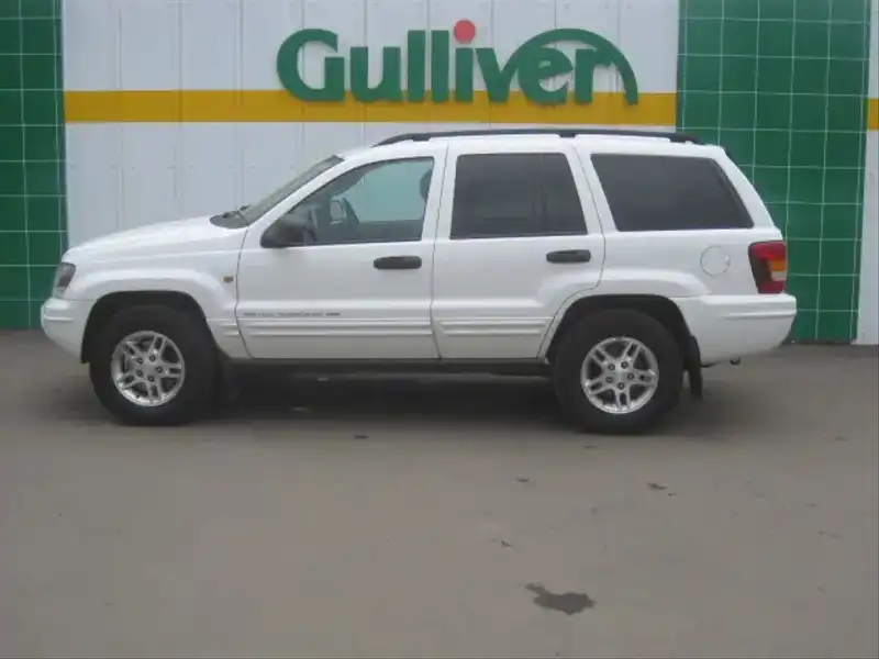 10010057 | カタログ画像：ジープ・グランドチェロキー（JEEP GRAND CHEROKEE） ラレード 2003年6月 GH-WJ40 4000cc ストーンホワイトクリアコート 外装